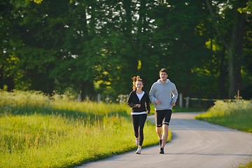 Image showing Young couple jogging