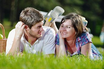 Image showing happy young couple having a picnic outdoor