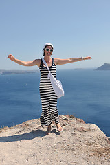 Image showing Greek woman on the streets of Oia, Santorini, Greece