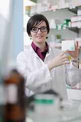 Image showing pharmacist chemist woman standing in pharmacy drugstore
