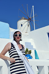 Image showing Greek woman on the streets of Oia, Santorini, Greece