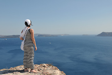 Image showing Greek woman on the streets of Oia, Santorini, Greece