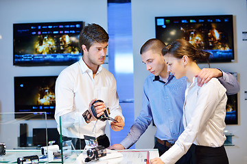 Image showing Young couple in consumer electronics store