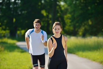 Image showing Young couple jogging at morning