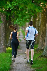 Image showing Young couple jogging