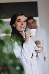 Image showing Young love couple taking fresh morning cup of coffee