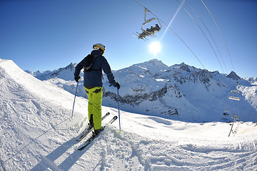 Image showing skiing on fresh snow at winter season at beautiful sunny day