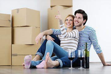 Image showing Young couple moving in new house