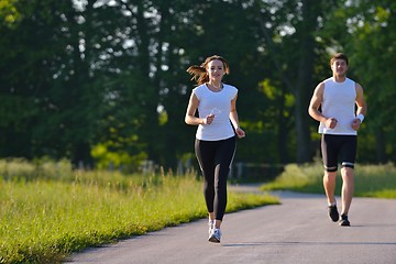 Image showing Young couple jogging