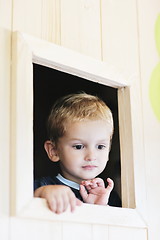 Image showing happy child in a window