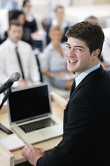 Image showing Young  business man giving a presentation on conference