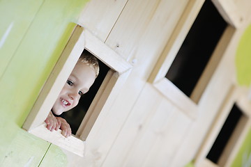 Image showing happy child in a window