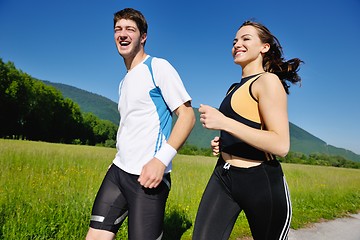 Image showing Young couple jogging