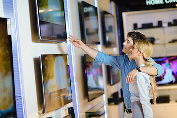 Image showing Young couple in consumer electronics store