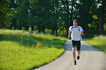 Image showing Young couple jogging