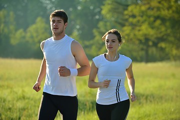 Image showing Young couple jogging at morning