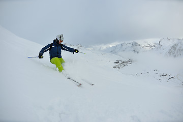 Image showing skiing on fresh snow at winter season at beautiful sunny day