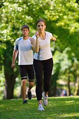 Image showing Young couple jogging at morning