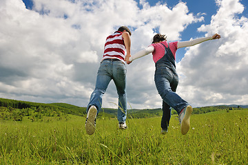 Image showing Portrait of romantic young couple smiling together outdoor