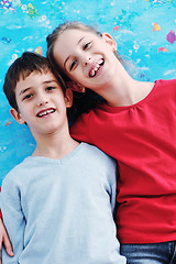 Image showing portrait of happy brother and sister at home