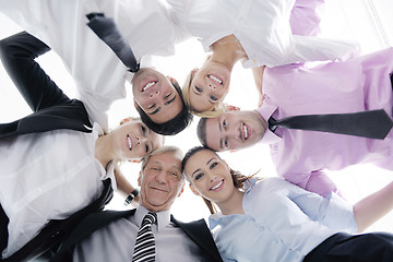 Image showing business people with their heads together