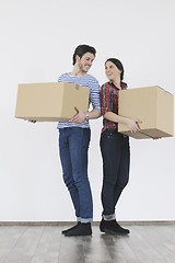 Image showing Young couple moving in new home