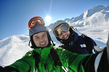 Image showing winter portrait of friends at skiing