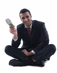 Image showing Business man holding money