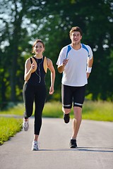 Image showing Young couple jogging