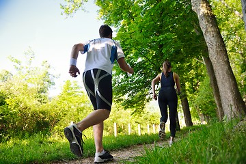 Image showing Young couple jogging