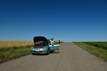 Image showing woman with broken car