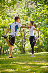 Image showing Couple doing stretching exercise  after jogging