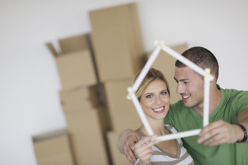 Image showing Young couple moving in new home