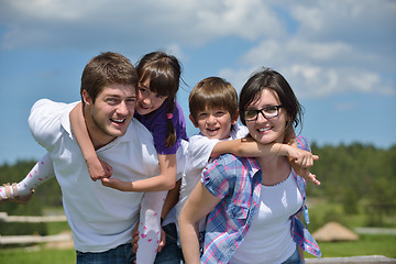 Image showing happy young family have fun outdoors