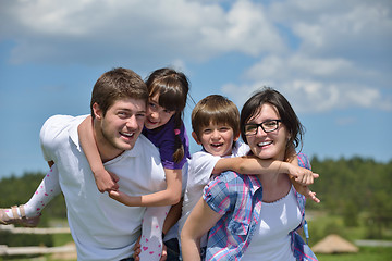 Image showing happy young family have fun outdoors