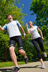 Image showing Young couple jogging