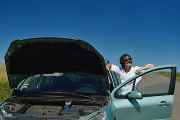 Image showing woman with broken car