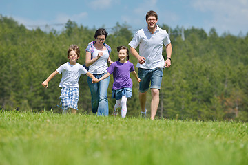 Image showing happy young family have fun outdoors