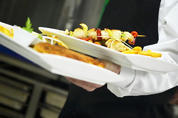 Image showing male chef presenting food