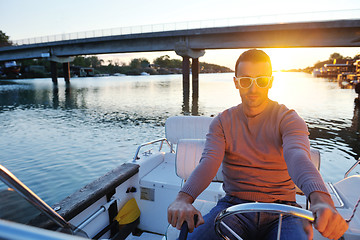 Image showing portrait of happy young man on boat