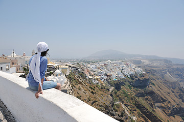 Image showing Greek woman on the streets of Oia, Santorini, Greece