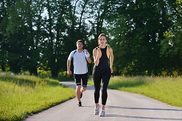 Image showing Young couple jogging