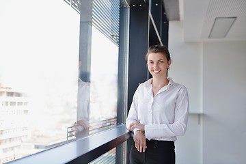 Image showing business woman with her staff in background at office