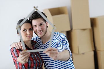 Image showing Young couple moving in new house