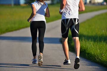 Image showing Young couple jogging