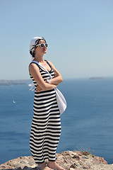 Image showing Greek woman on the streets of Oia, Santorini, Greece