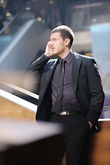 Image showing young business man talking by cell phone