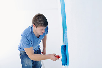 Image showing happy couple paint wall at new home