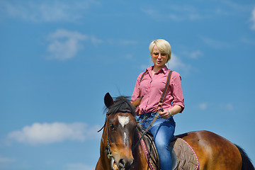 Image showing happy woman  on  horse