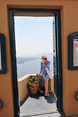 Image showing Greek woman on the streets of Oia, Santorini, Greece